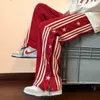 Męskie spodnie 2023 Mężczyzn Hip Hop Pants Boczne przyciski Elastyczne talia luźne joggery spodnie J230420