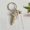 Keychains Metal Water Gun Keychain Car Wash Tools High-pressure Model Key Chain Party Gift Pendant Ring K2011