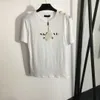 23ss designkläder för dam T-shirt Dam T-shirt Rund hals Ren bomull Axelknapp hett guld monogramtryck kortärmad T-shirt Damkläder av hög kvalitet a1