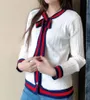 Kvinnor tjock stickad hjärttröja Elegant Bow Tie Pearl Button O Neck Kvinna Autumn Winter Coat Ladies Stripe Jacket