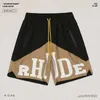 Ropa de diseñador Rhude Carta Impreso Contraste Color Patchwork Shorts High Street Trendy Brand Pantalones sueltos de cinco piezas Hombres Parejas Joggers Ropa deportiva