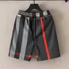 Luxe heren- en damesontwerper geruite gestreepte shorts Zomermode Streetwear Sneldrogende badkleding Strandbroeken met print Aziatische maat M-3XL