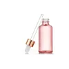 Różowe szklane olejki eteryczne Butelki Perfumy butelka z kroplą do oczu ze złotą czapką i białą gumową top Junjj