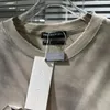 T-shirt da uomo Camicia traforata tinta unita invernale Uomo Donna T-shirt con lettera ricamata a maniche lunghe danneggiata di alta qualità 1:1