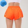 L-091 Hot Low Rise Shorts Breattable Quick-Dry Yoga Inbyggd fodrad sport kort dold blixtlås sido-droppfickor som kör svettbyxor med kontinuerlig dragkord66