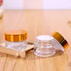 Clear Glass Cosmetic Cream Bottle Round burkar flaska med inre PP -foder för hand ansikte grädde flaska 5 g till 100 g guld silver lock vpoca