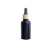 Matte Black Glass e liquid Essential Oil Perfume Bottle with Reagent Pipette Dropper and Wood Grain Cap 10/30ml Qakht