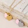 Plaqué or 18 carats Designer de luxe Love Heart Pendentif Collier Lettre Femme Titane Acier bleu rose vert Bijoux élégants Cadeau de Noël de haute qualité