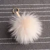 Porte-clés de luxe 15cm moelleux boule de fourrure de raton laveur porte-clés réel Pom porte-clés pompon porte-clés charme femmes sac pendentif décembre