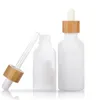 Bouteilles d'huile essentielle en verre de porcelaine blanche Flacon compte-gouttes de sérum de soin de la peau avec pipette en bambou 10 ml 15 ml 20 ml 30 ml 50 ml 100 ml Wbjuv