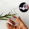Bottiglia di plastica PET disinfettante per le mani vuota da 30 ml con tappo a scatto bottiglia a forma trapezoidale per liquido disinfettante struccante Imdok