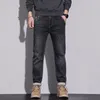 Jeans masculinos outono moda cintura bordada etiqueta de couro diagonal bolso tendência pequena calça jeans