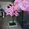 装飾的な花人工木1.5m桜の花と淡いピンクの濃い桃の屋内リビングルームの植物