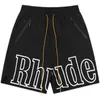 Дизайнерская одежда Rhude High Street Fog Small Crowd Tide Brand Sports Leisure Loose Beach Pants American Shorts Мужские брюки Пары Бегуны Спортивная одежда для продажи