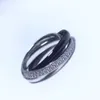 Nuevo Anillo de tres diamantes plateado y negro para hombre y mujer, estilo de anillo de pareja, diseño avanzado de lujo ligero