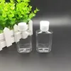 Bouteille en plastique PET de 60 ml avec capuchon rabattable, bouteille de forme carrée transparente pour démaquillant, désinfectant pour les mains jetable Shlhv