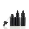 Botellas de perfume de aceite esencial de vidrio esmerilado negro e botella cuentagotas de pipeta de reactivo líquido de 5 ml a 100 ml Scdac