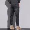 Jeans masculinos outono moda cintura bordada etiqueta de couro diagonal bolso tendência pequena calça jeans