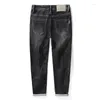 Dżinsy męskie jeansowe mody haftowana skórzana etykieta przekąska kieszonkowa