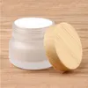 Bouteilles de crème de pot en verre givré pots cosmétiques ronds bouteille de pompe de lotion pour le visage avec bouchon en grain de bois Vxntg