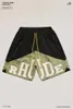 Ropa de diseñador Rhude Carta Impreso Contraste Color Patchwork Shorts High Street Trendy Brand Pantalones sueltos de cinco piezas Hombres Parejas Joggers Ropa deportiva