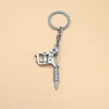 Keychains Fashion Heyu Hip Hop Jewelry Men Gun Pendant Keychain Keyring Tattoo Machine Nyckel Holder Metal Accessories Porf Clef 1pcs