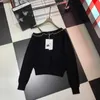 Tricots pour femmes Tees Designer 23 Automne Nouveau Style Sexy Fille Épicée Tempérament Âge Réduit Un Côté Hors Épaule Chaîne À Manches Longues Tricot OWO1