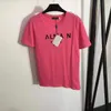 23デザイナーTシャツ女性ティーアパレル新しいショルダーボタンホットゴールドレタープリント短袖Tシャツホワイトローズレッドブラックトップ