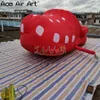 Maquette de sabots gonflables rouges personnalisés, pantoufles avec souffleur pour salon commercial/publicité/décoration commerciale