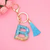 Colgante de llavero Simple de 26 letras con borla azul para niñas, adorno colgante para bolso, iniciales de A-Z, accesorios para llaves de resina