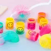 Nouveau 36/24/12/6/2 pièces arc-en-ciel sourire ressorts magiques cercle jouets pour enfants fête d'anniversaire faveurs cadeaux drôles jouets magiques pour enfants