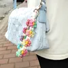 Portachiavi con fiore margherita Stile bohémien Donna Uomo Portachiavi per auto Ragazze Charms Borsa Zaino Ciondolo Cordino da polso Bracciale