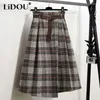 Jupes 2023 automne hiver Plaid impression a-ligne jupe femmes élastique taille haute asymétrique Patchwork tout-match femme vêtements