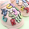 MOQ 20 Pz PVC Cartoon 26 Lettere Alfabeto Occhi Decorazione Scarpe Fascino Fibbia Accessori Clog Pins Bottoni Decorazioni per Fasce Bracciali