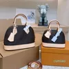 2023 Mujer Crossbody Shell Bolsas Bolsa de diseñador Conchas Bolso Bolso de lujo Bolso de hombro Monederos Smal Mini Totes Impresión de cuero Carta de flores