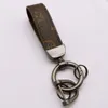 2023 PU Leather Keychain Designer Key Chain Buckle Lovers Car Handmade Keychains Men Women Bag Pen Ely Purse Vuttonly