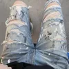 Designer Clothing Denim Pants Amiiri Speckled Ink Hole Blue Jeans Handmade Knife Cut Damaged High Street Elastic Water Wash Used Slim Fit Distressed Ripped Pants