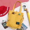 Sacos escolares estilo coreano estudante versátil bolsa crossbody simples carta impressa ombro grande capacidade casual lona mensageiro