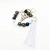 Wholesale of cross-border new bracelets, keychains, printed wooden bead beads, PU leather tassel pendants, keyrings
