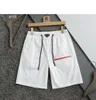 Pantalones cortos de diseñador para hombres y mujeres Ropa de calle de moda de verano en blanco y negro Traje de baño de secado rápido Pantalones de playa de tablero impreso M-3XL