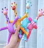Suction cup giraffe ever-changing luminous cartoon telescopic children's baby educational parent-child interactive stretch tube decompression toy