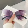 Solglasögon lyxiga Rimless Butterfly Women Brand Y2K Vintage Overdimensionerad färgglada lins solglasögon damer Eyewear Gafas de Sol