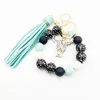 Wholesale of cross-border new bracelets, keychains, printed wooden bead beads, PU leather tassel pendants, keyrings