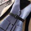 Tvådelad klänning med bältesmedelsväst stickad pullover tröja set kvinnors höst och vinterkoreansk version av den franska klänningen topp två paj 231124