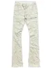 メンズジーンズの到着淡い黄色の積み重ねられたパンツカジュアルストリートウェア綿の伸縮性フレアタッセル男性ズボン