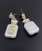 Boucles d'oreilles blanches en forme de bouteille de parfum, Design de luxe pour dames, dernière bouteille de parfum à 5 mots, 2023