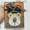 Animal Keychain Bluetooth Earphones AirPods Case Key Rings, Brown Flower Lion Head Storage Bag Keyring Accessories, Creative Wallet Car Keys Pendant Holder