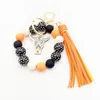 Wholesale of cross-border new bracelets, keychains, printed wooden bead beads, PU leather tassel pendants, keyrings