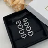 Design hjärtformade kvinnors långa dingle örhängen, mode ihåliga set diamant damer örhängen grossist gåvor till vänner