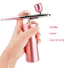 Устройства для ухода за лицом Top 0,4 мм Pink Mini Air Compressor Kit Аэрограф Пистолет-распылитель Аэрограф для дизайна ногтей Татуировка Craft Cake Nano Fog Mist Spray 230424
